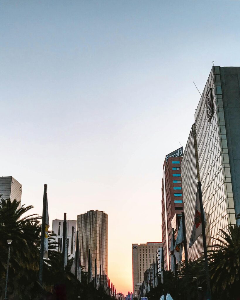 Captivating view of Mexico City's skyline at sunrise, featuring modern skyscrapers and urban landscapes.